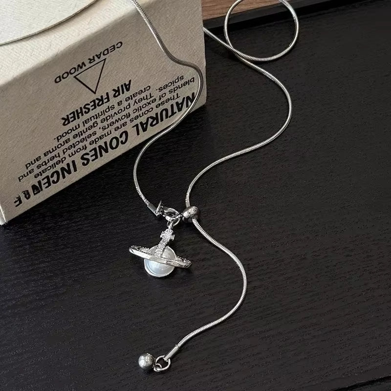 Hot Sale of the Season Pearl Saturn Pendant Necklace Adjustable Titanium Steel Sweater Chain Women'S Fashionable Jewelry Accesso